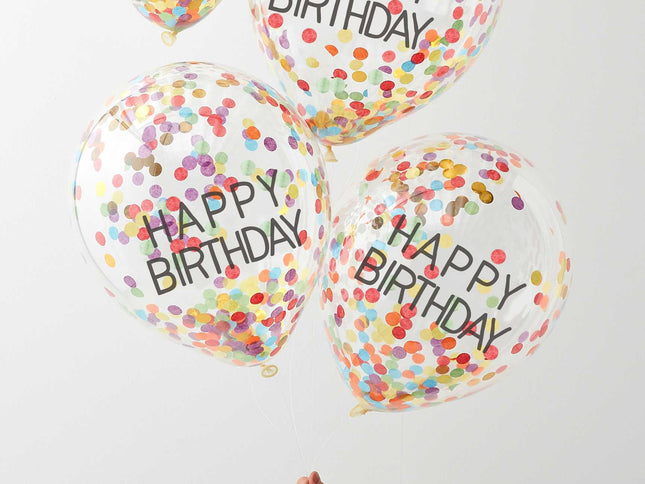 Nušvieskite gimtadienį šiais vaivorykštiniais konfeti balionais ir sukurkite nuostabiai spalvingą vakarėlį! Skaidrūs balionai su užrašu "Happy Birthday" pripildyti spalvotų konfeti gabalėlių! Kad konfeti geriausiai priliptų prie balionų šonų, rekomenduojame vaivorykštinius balionus pripūsti helio ir oro mišiniu! Kiekvienoje pakuotėje yra 5x 12 colių (30 cm) balionai.