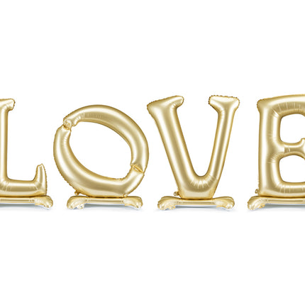 Pastatomas folinis balionas „LOVE“, auksinis. Satininio paviršiaus. Dydis nepripūtus – apie 350 x 114 cm, pripūtus 300 x 97 cm. Skirtas pildyti oru. Komplekte pridedamas šiaudelis. Puikiai tinka kaip šventės akcentas ar foto siena.