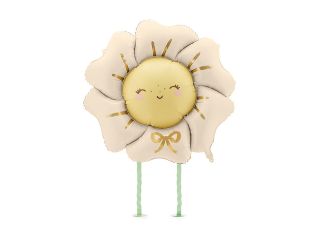 Folinis balionas „Gėlė“.  Šviesiai smėlinės spalvos, su kojytėmis. Dydis nepripūtus – apie 104 x 104 cm, pripūtus 80 x 80 cm. Kojyčių aukštis – apie 40 cm. Tinka pildyti oru arba heliu. Komplekte pridedamas šiaudelis.